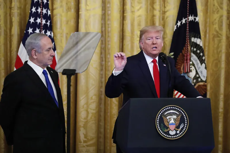 President Donald Trump, joined by Israeli Prime Minister Benjamin Netanyahu, speaks during an event in the East Room of the White House in Washington, Tuesday, Jan. 28, 2020, to announce the Trump administration's much-anticipated plan to resolve the Israeli-Palestinian conflict. (AP Photo/Alex Brandon)