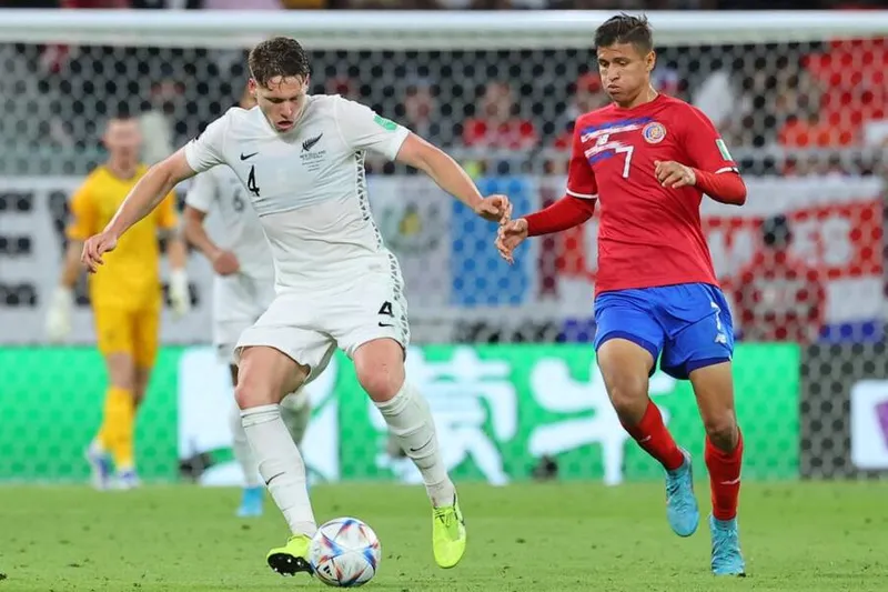 New Zealand's defender Nando Pijnaker (L) is marked by Costa Rica's forward Anthony Contreras during the FIFA World Cup 2022 inter-confederation play-offs match between Costa Rica and New Zealand on June 14, 2022, at the Ahmed bin Ali Stadium in the Qatari city of Ar-Rayyan. (Photo by KARIM JAAFAR / AFP)